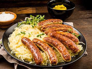 Another German national dish is bratwurst with sauerkraut, accompanied by a beer. Cheers 